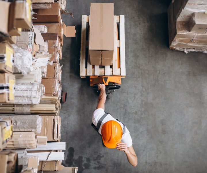 young-man-working-warehouse-with-boxes